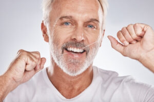 how to clean dental implants flossing